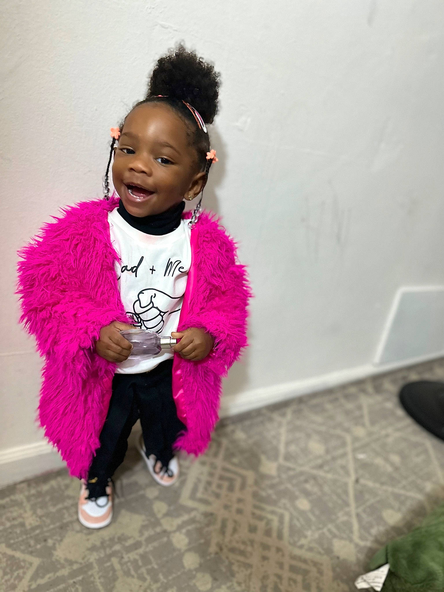 Leilani is registered to the contest to win money with this photo: afro, child, child_model, fashion_accessory, flooring, fun, fur, happy, jewellery, leisure, magenta, person, pink, portrait_photography, sitting, sleeve, smile, toddler