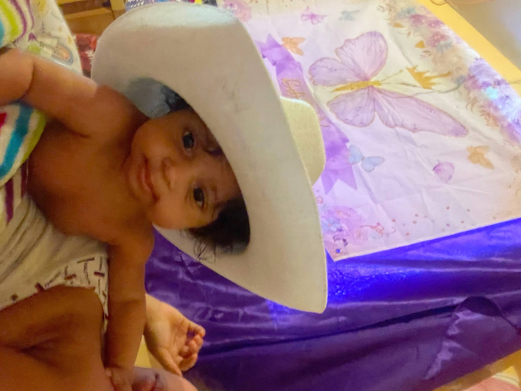 Ocean joined the competition — help win amazing prizes! abdomen, baby, baby_products, bed, chest, child, comfort, finger, fun, happy, headgear, headwear, infant_bed, linens, magenta, person, product, purple, skin, textile