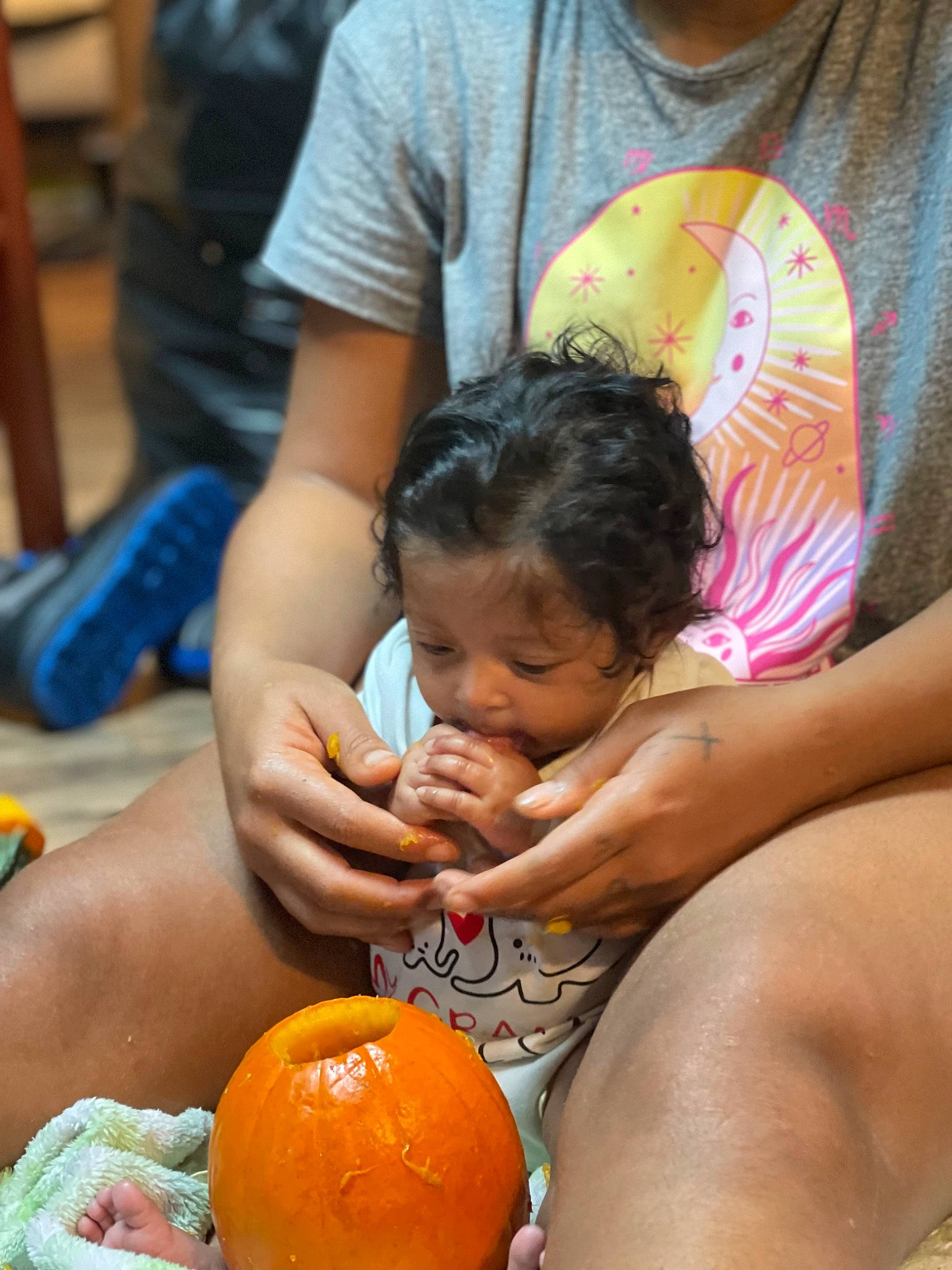 Ocean is registered to the contest to win money with this photo: abdomen, arm, baby, calabaza, child, citrus, event, fruit, fun, happy, human, leisure, natural_foods, person, shorts, sitting, t_shirt, thigh, toddler, winter_squash