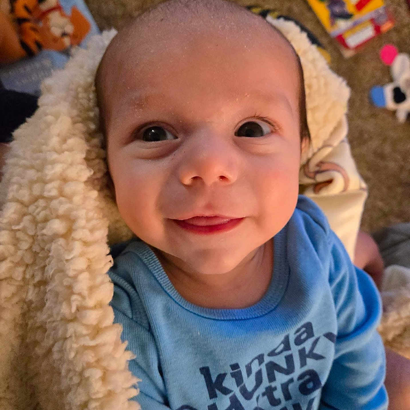 Jaxxon is registered to the contest to win money with this photo: baby, blanket, clothing, cushion, face, happy, hat, head, homedecor, knitwear, laughing, newborn, person, photography, portrait, quilt, selfie, sitting, smile, t_shirt