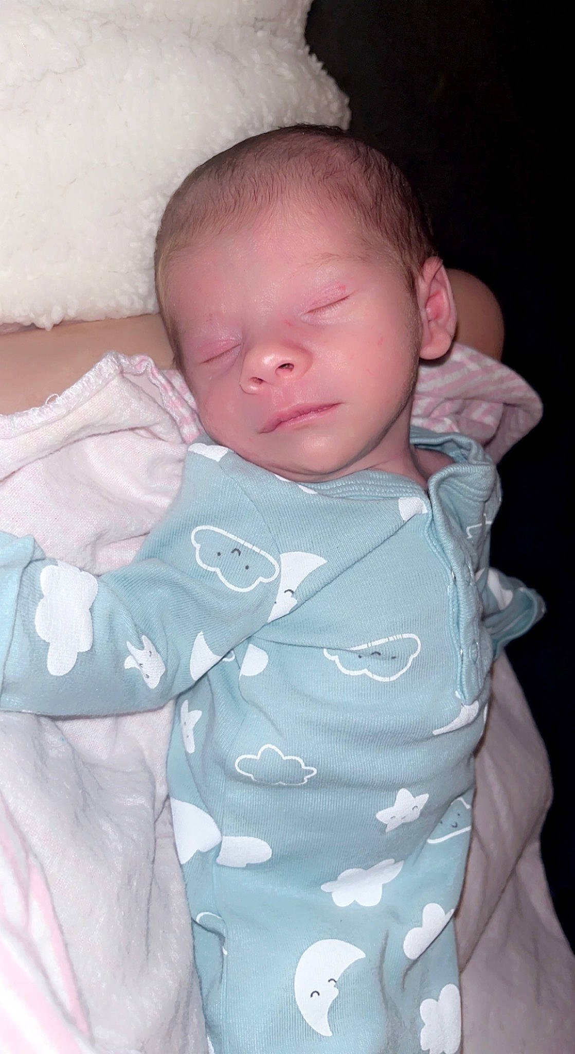 Jersey is registered to the contest to win money with this photo: baby, baby_toddler_clothing, cheek, chin, collar, comfort, eyebrow, finger, gesture, hand, human_body, lip, mouth, neck, nose, person, pink, product, skin, sleeve