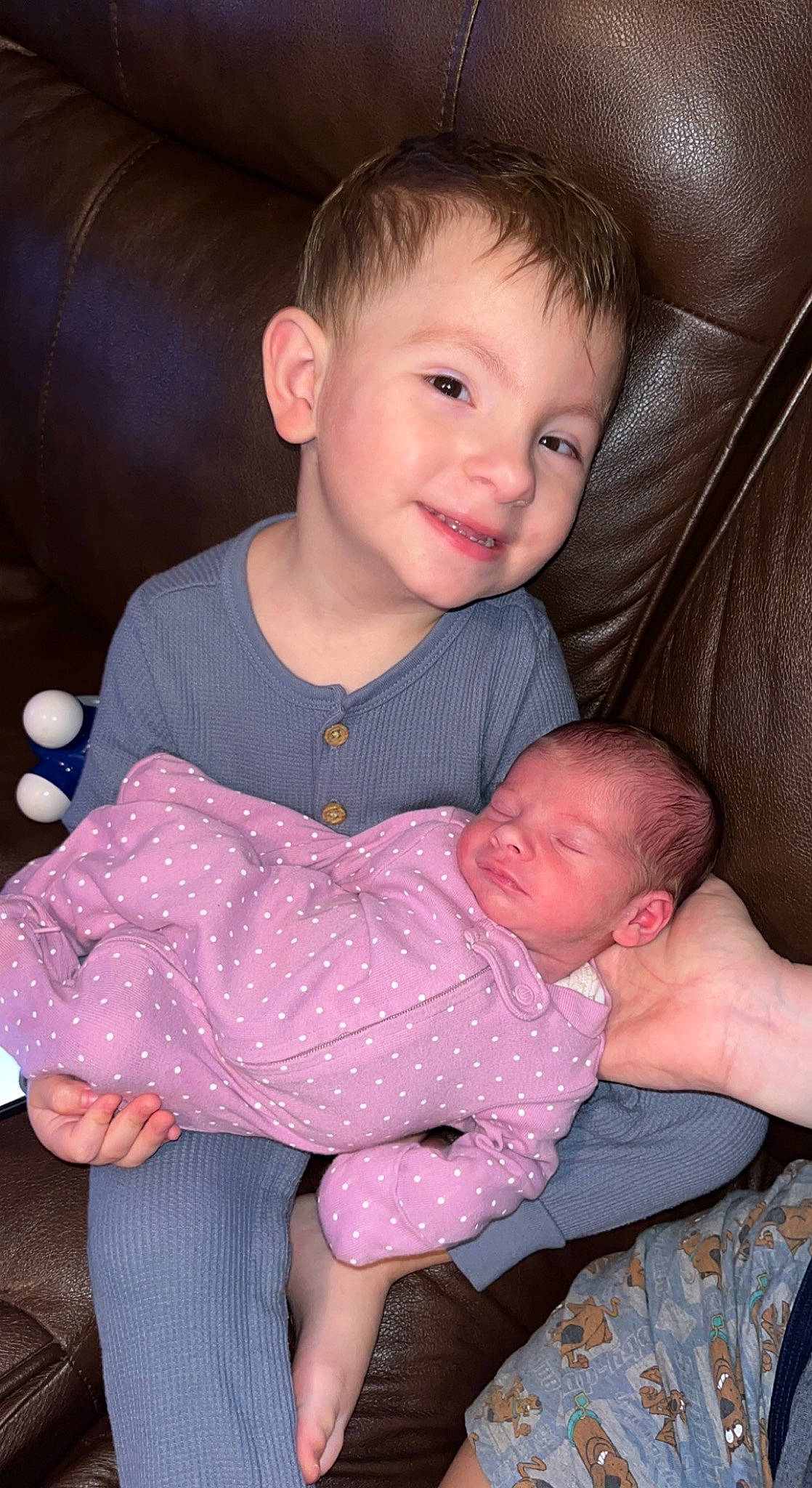 Maddox is registered to the contest to win money with this photo: arm, baby, baby_toddler_clothing, cheek, child, comfort, finger, fun, hairstyle, happy, iris, joy, lap, organ, pattern, person, sitting, skin, sleeve, smile