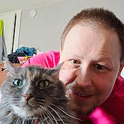 Sissy is registered to the contest to win money with this photo: animal, background, casual, cat, closeup, clothing, cute, domestic, expression, face, friendly, furniture, hair, indoor, person, pet, portrait, room, smile, whiskers