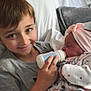 Nathan a rejoint le concours — aidez-le/la à gagner de superbes lots ! baby, bed, blanket, bottle, boy, child, clothing, comfort, cute, face, family, feeding, headband, infant, love, person, portrait, smile, toddler, warmth