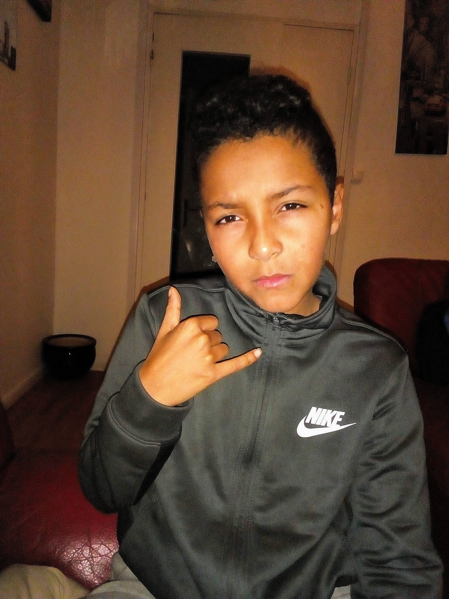 Rudy participe au concours pour gagner de l'argent avec cette photo : black_hair, boy, cheek, chin, cool, day, eyebrow, face, finger, forehead, fun, girl, hairstyle, head, jaw, mouth, neck, person, product, smile