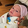 newborn, baby, infant, blanket, hat, hand, rings, wrapped, looking_up, indoors, person, cute, soft, warm, skin, portrait, newborn_hat, baby_clothes, human, care