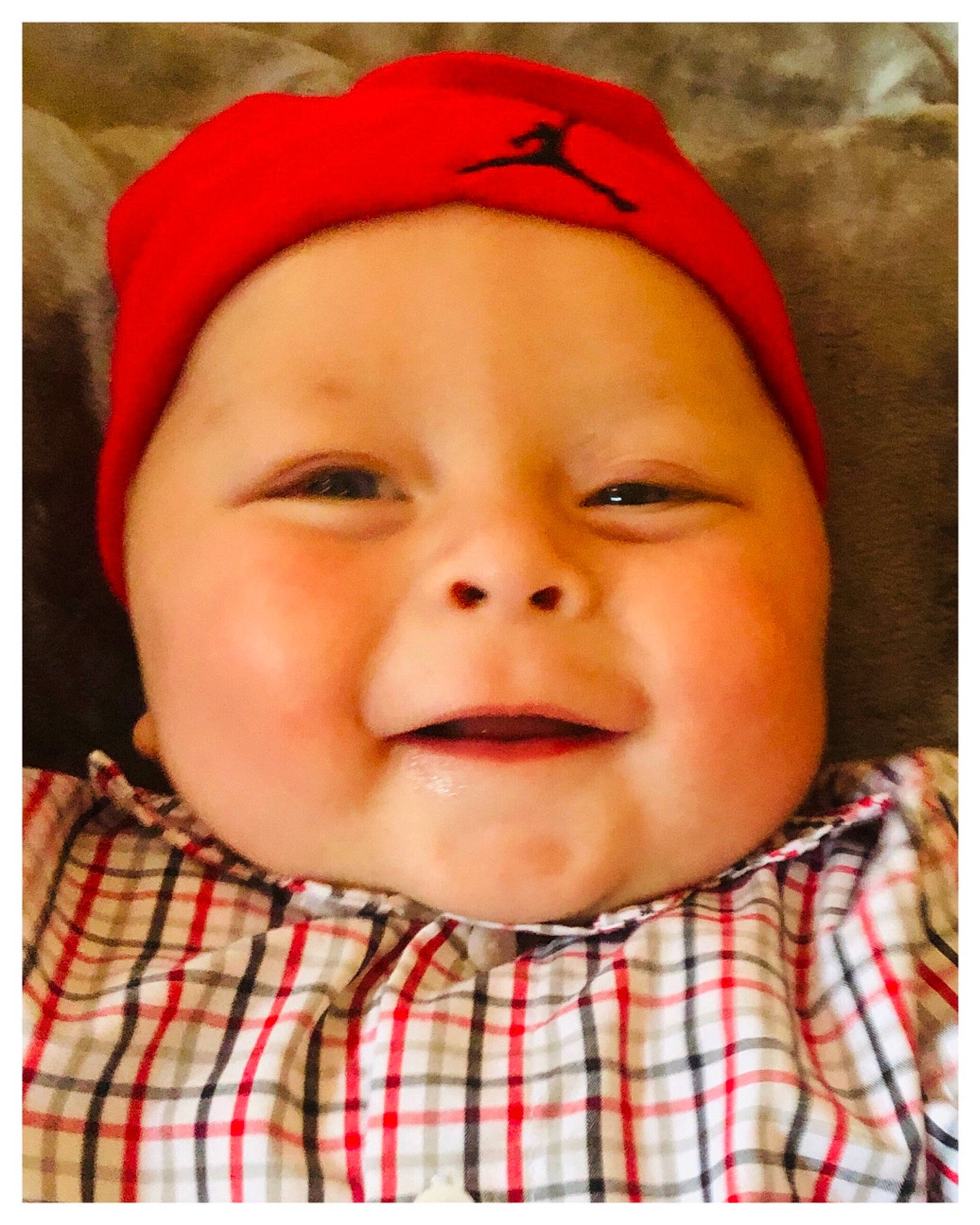 Tanner is registered to the contest to win money with this photo: baby, baby_laughing, baby_toddler_clothing, beauty, cap, cheek, child, collar, eye, happy, headwear, lip, nose, pattern, person, photograph, plaid, sleeve, smile, tartan