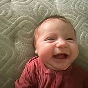 Ramonna joined the competition — help win amazing prizes! baby, smiling, infant, face, clothing, red_outfit, mattress, texture, happy, child, cute, portrait, lying_down, skin, head, young, indoors, expression, joy, person