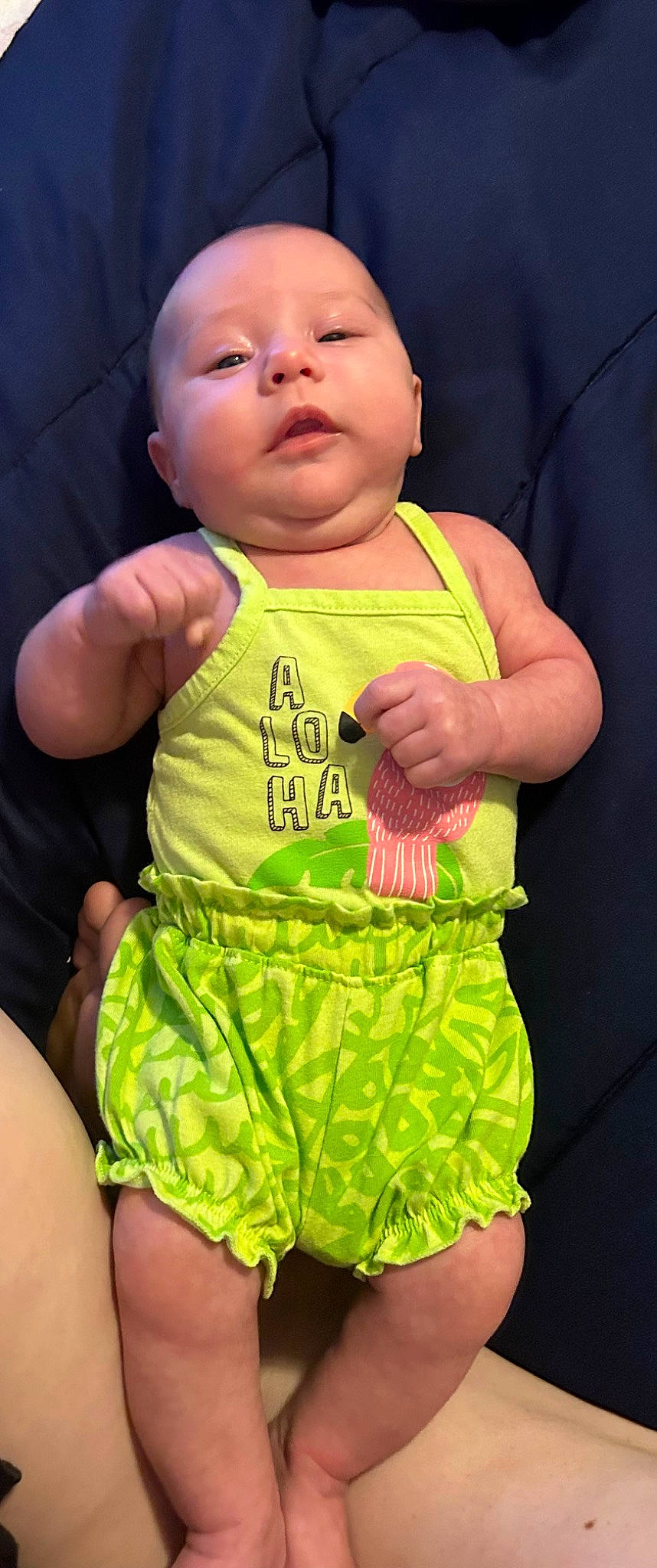Kya is registered to the contest to win money with this photo: active_tank, baby, baby_toddler_clothing, cheek, eye, face, finger, gesture, green, hand, happy, head, one_piece_garment, person, pink, skin, sleeve, sleeveless_shirt, thumb, toddler
