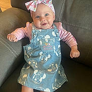 Ava joined the competition — help win amazing prizes! baby, child, smiling, headband, bow, dress, minnie_mouse, sitting, couch, furniture, indoors, cute, happy, person, clothing, pink, blue, infant, portrait, young