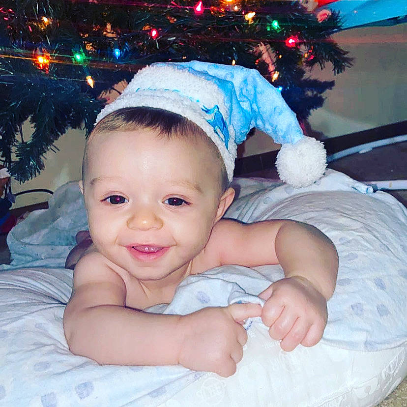 Jaydon joined the competition — help win amazing prizes! baby, baby_toddler_clothing, child, christmas, christmas_decoration, christmas_eve, christmas_lights, christmas_ornament, christmas_tree, comfort, costume_accessory, event, finger, happy, holiday, holiday_ornament, human, joy, linens, ornament