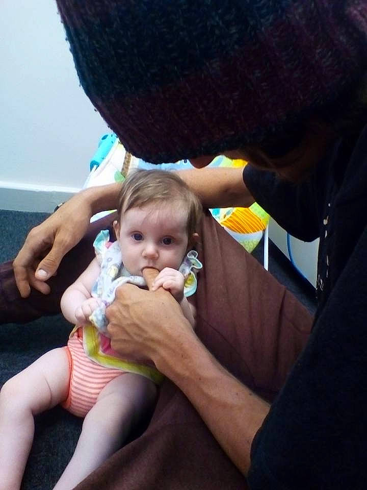 Marcy joined the competition — help win amazing prizes! baby, child, ear, finger, hand, lap, leg, nail, person, sitting, skin, thumb, toddler, vacation