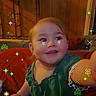 Lilia joined the competition — help win amazing prizes! child, colorful_art, couch, cozy, cute, four_leaf_clover, green_shirt, happy, indoor, pixel_effect, playful, portrait, reaching_hand, room, smiling, sparkles, toddler, warm_lighting, wood_paneling, young_child