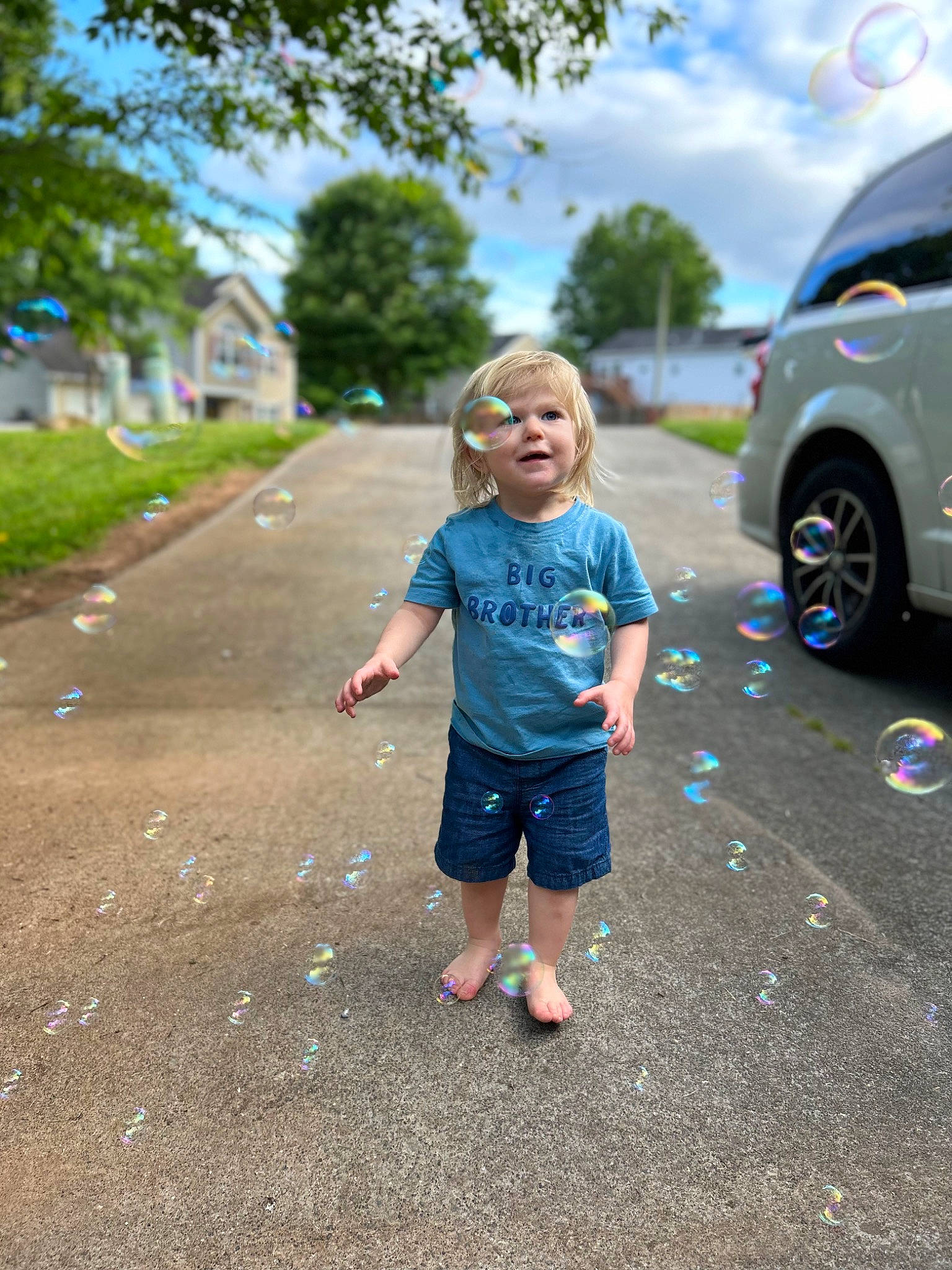 Maverick joined the competition — help win amazing prizes! asphalt, car, child, electric_blue, grass, leaf, leisure, person, plant, recreation, road, road_surface, shorts, sidewalk, sky, t_shirt, tire, toddler, tree, vehicle