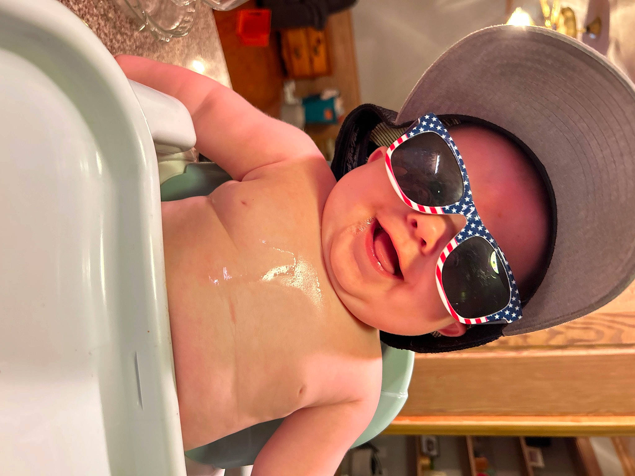 Memphis is registered to the contest to win money with this photo: black_hair, chest, eyelash, eyewear, fun, glasses, goggles, happy, hat, headgear, leisure, person, personal_protective_equipment, smile, sunglasses, swimming_pool, swimwear, thigh, throat, trunk