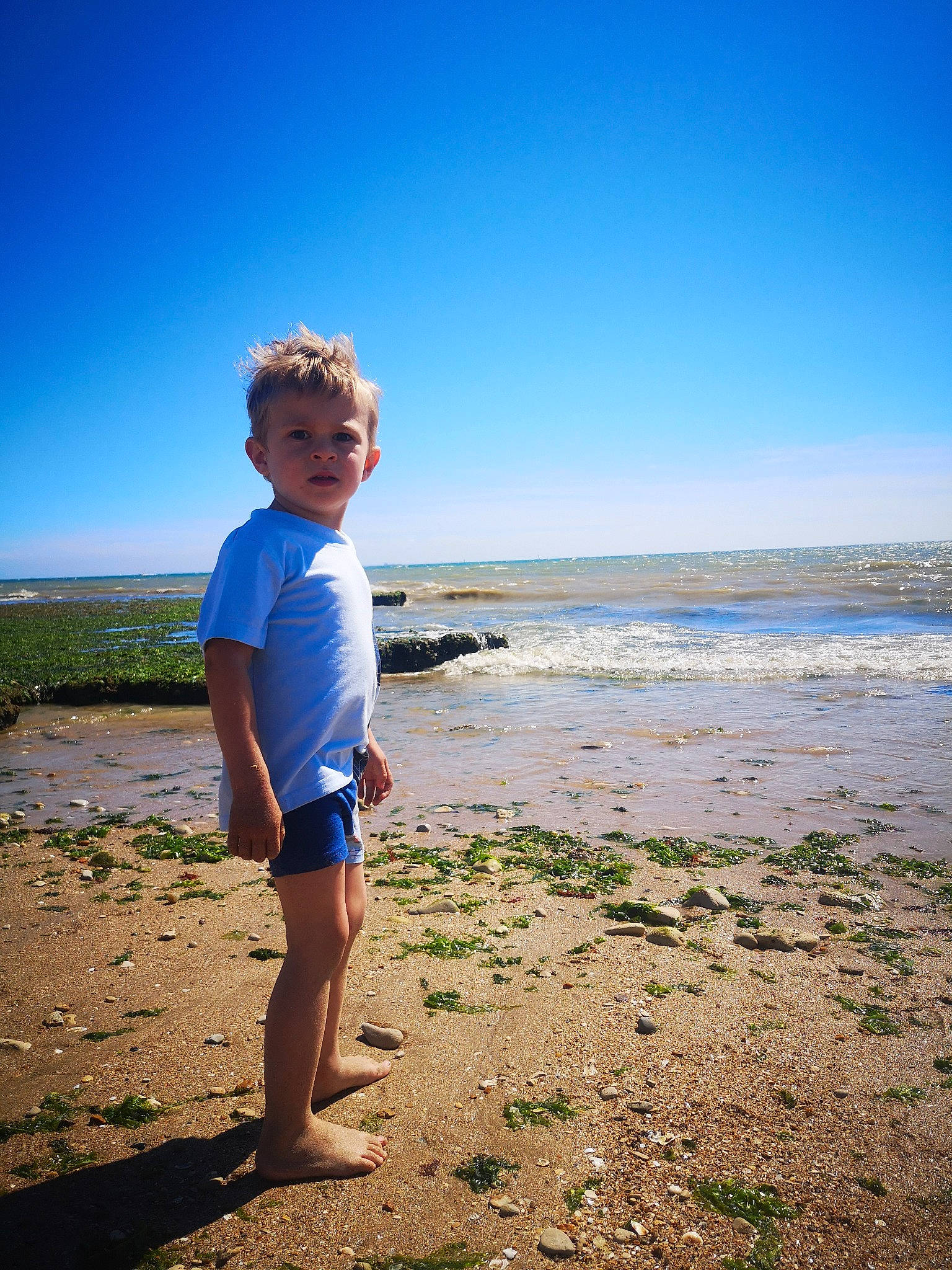 Aaron participe au concours pour gagner de l'argent avec cette photo : azure, beach, cloud, coastal_and_oceanic_landforms, electric_blue, flash_photography, fun, happy, horizon, landscape, leisure, people_in_nature, people_on_beach, person, sky, smile, sunlight, toddler, travel, water