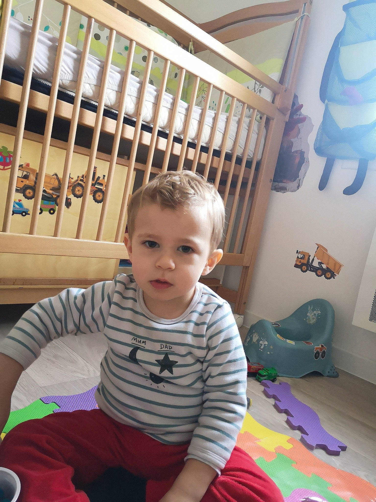 Aaron participe au concours pour gagner de l'argent avec cette photo : baby, baby_toddler_clothing, child, comfort, facial_expression, floor, flooring, fun, happy, hardwood, mammal, person, photograph, product, sitting, sleeve, snapshot, standing, toddler, white
