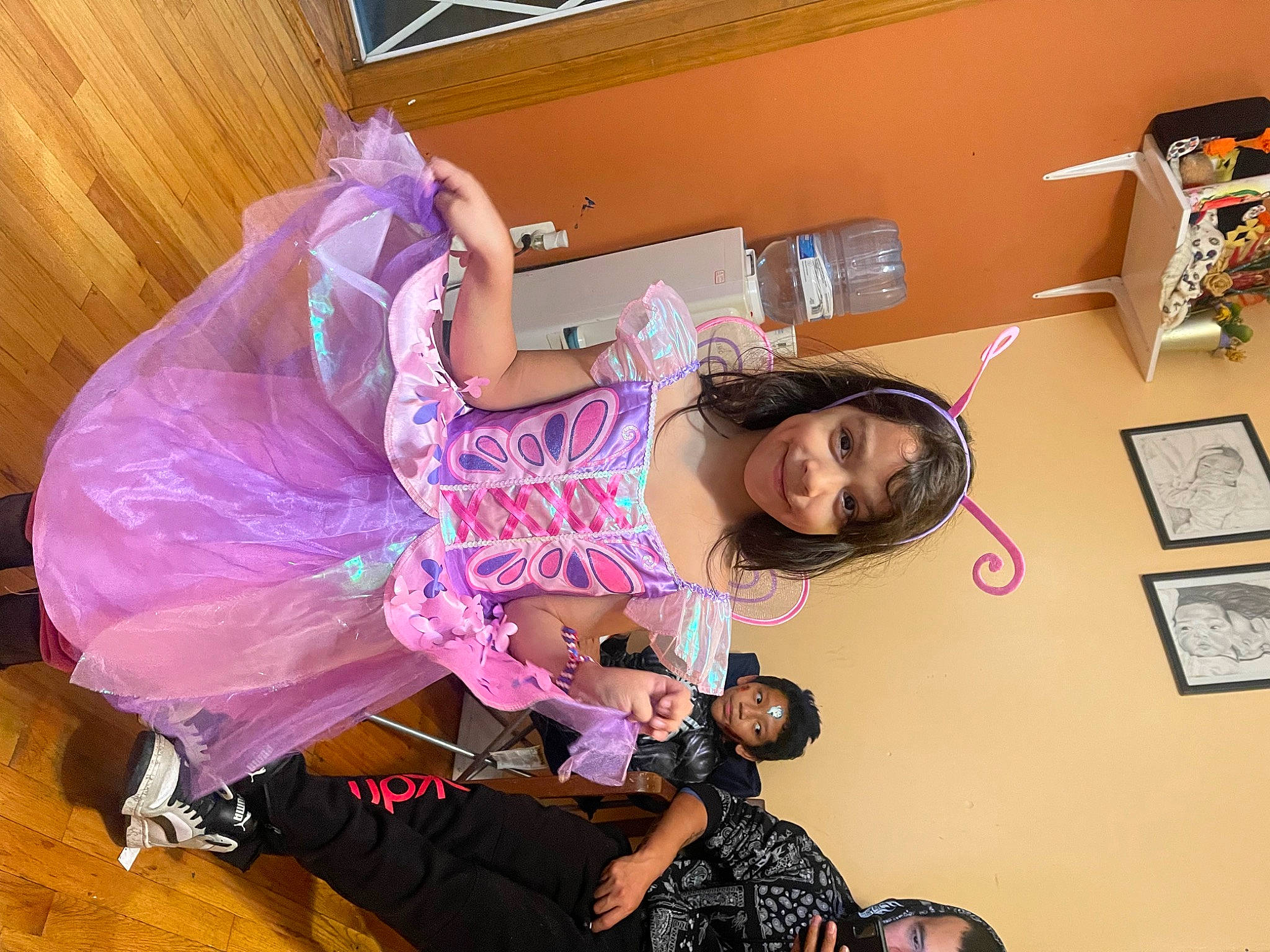 Lynnette is registered to the contest to win money with this photo: arm, child, event, eyewear, fashion_design, flooring, fun, hair, happy, joy, magenta, party, person, picture_frame, pink, purple, room, smile, toddler, visual_arts