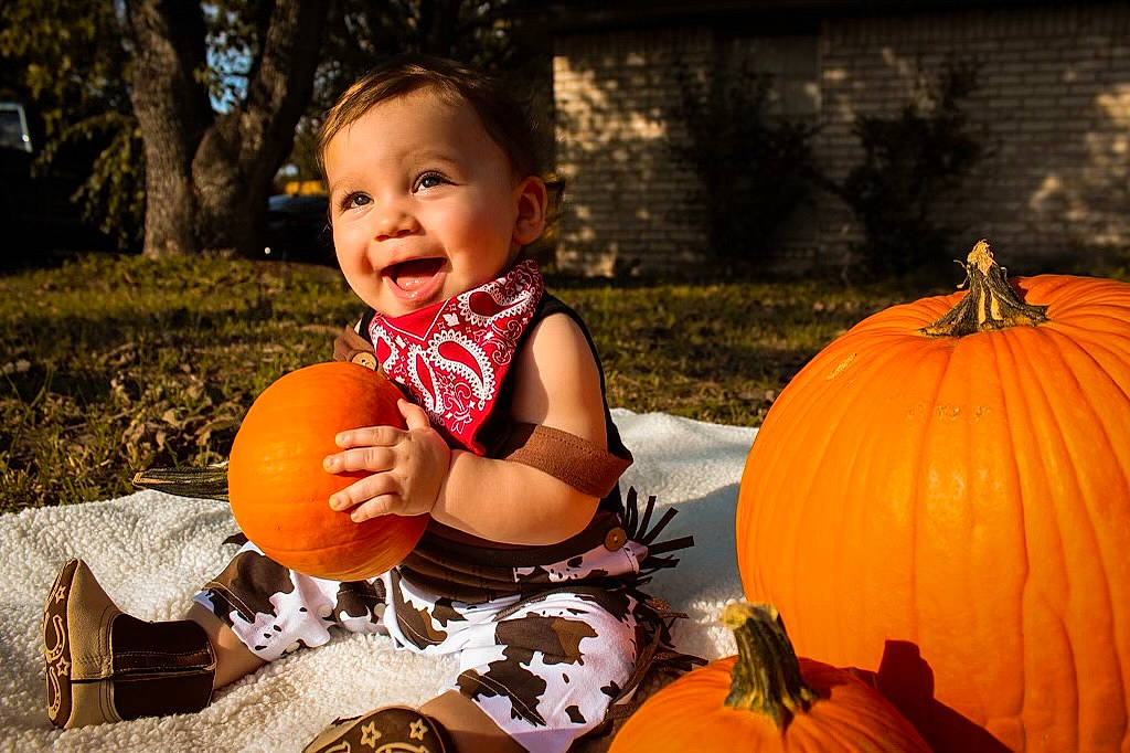 Madden joined the competition — help win amazing prizes! calabaza, eye, facial_expression, gourd, grass, happy, leaf, natural_foods, orange, people_in_nature, person, photograph, plant, playing_with_kids, pumpkin, smile, squash, toddler, tree, winter_squash