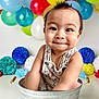 baby, balloon, bathing, bucket, clothing, dress, face, flower, flowerarrangement, flowerbouquet, happy, head, people, person, photography, portrait, sitting, sleeve, smile, summer