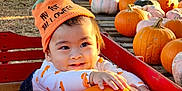 Ezekiel Dan joined the competition — help win amazing prizes! baby, baseballcap, cap, clothing, countryside, face, farm, food, footwear, hat, head, person, photography, plant, portrait, produce, pumpkin, shoe, squash, vegetable