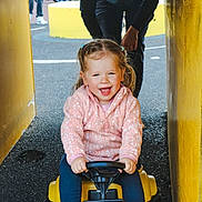 Isla is registered to the contest to win money with this photo: adult, child, city, clothing, face, female, footwear, girl, grass, head, male, pants, person, photography, plant, portrait, road, shoe, street, urban