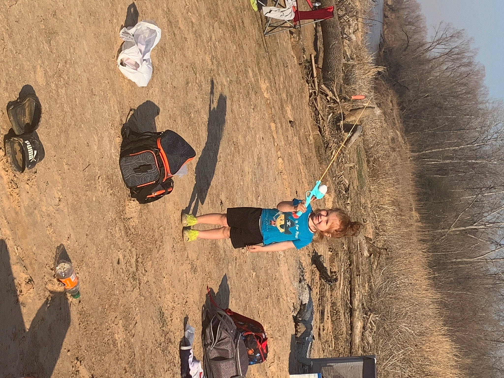 Malakai is registered to the contest to win money with this photo: adventure, climbing, extreme_sport, fun, geology, joy, landscape, leg, leisure, outdoor_shoe, person, recreation, rock, shadow, sky, slope, sneakers, soil, sport_climbing, tire