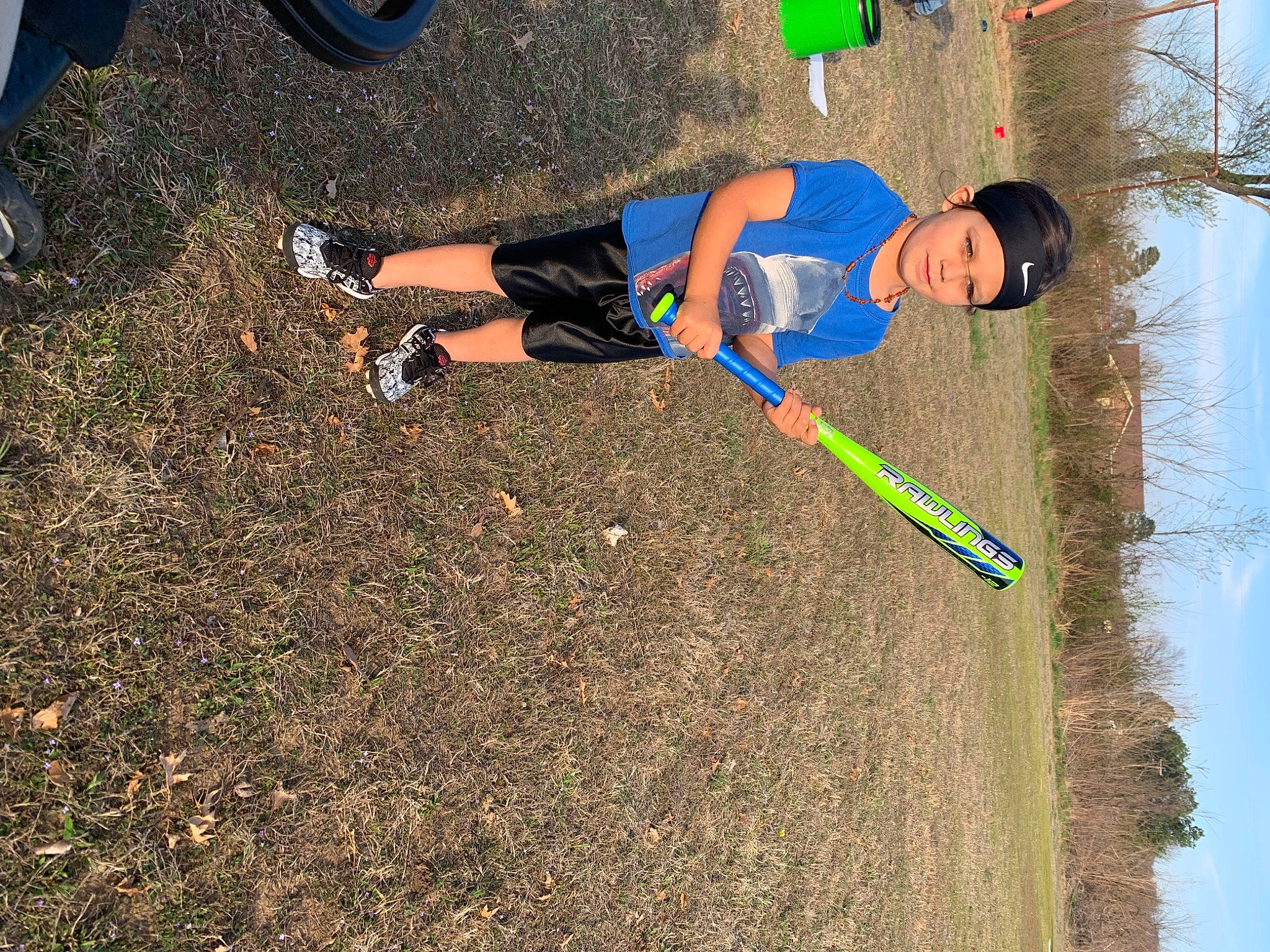 Ryder is registered to the contest to win money with this photo: asphalt, electric_blue, fun, grass, head, headwear, human_leg, leg, leisure, people_in_nature, person, plant, recreation, road_surface, shoe, shorts, sky, slope, sneakers, soil