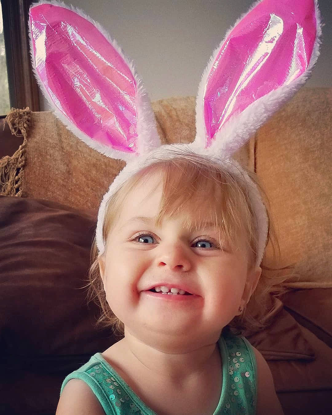 Leahmarie is registered to the contest to win money with this photo: child, ear, easter, easter_bunny, eye, face, head, human_body, iris, lip, organ, person, pink, rabbit, rabbits_and_hares, skin, smile