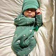 Tate joined the competition — help win amazing prizes! baby, infant, sleeping, onesie, hat, pacifier, bed, pillow, blanket, bedding, indoor, portrait, closed_eyes, hand, footed_pajamas, cozy, newborn, green_outfit, peaceful, cute