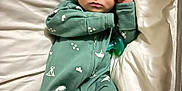 Tate joined the competition — help win amazing prizes! baby, infant, sleeping, onesie, hat, pacifier, bed, pillow, blanket, bedding, indoor, portrait, closed_eyes, hand, footed_pajamas, cozy, newborn, green_outfit, peaceful, cute