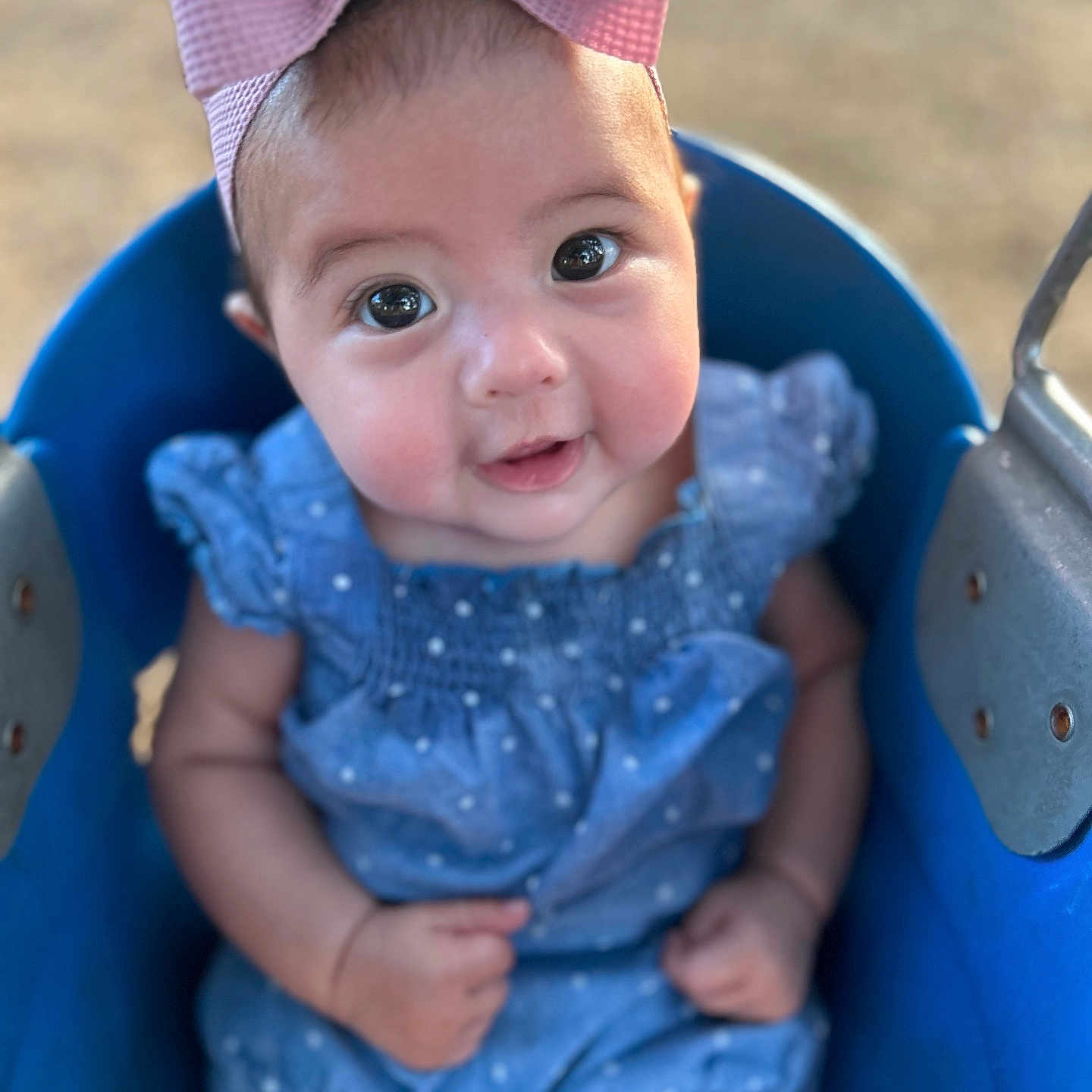 Arianna is registered to the contest to win money with this photo: accessories, baby, bonnet, cap, clothing, dress, face, happy, hat, head, outdoorplayarea, outdoors, person, photography, playarea, portrait, shorts, sitting, smile, toy