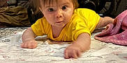 Catherine joined the competition — help win amazing prizes! baby, yellow_clothing, crawling, blanket, living_room, stroller, carpet, furniture, indoor, child, curious, young_child, person, floor, head, face, home, cozy, soft_toy, pink_blanket