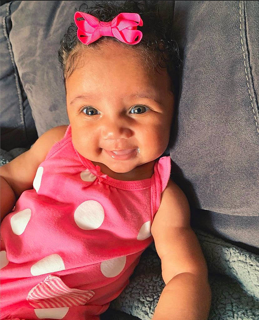 Javannah is registered to the contest to win money with this photo: baby, baby_toddler_clothing, cheek, chin, cool, eye, eyebrow, happy, head, iris, lip, mouth, neck, person, pink, purple, skin, sleeve, smile, textile