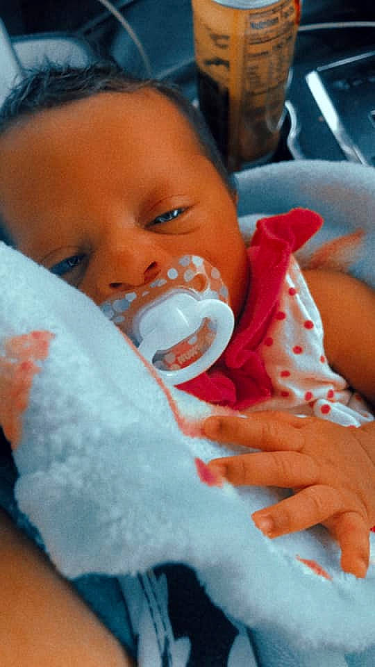 Danielle joined the competition — help win amazing prizes! baby, baby_products, baby_toddler_clothing, blue, cheek, child, comfort, drinkware, eyebrow, eyelash, finger, iris, lip, mouth, nail, nose, person, skin, textile, thumb