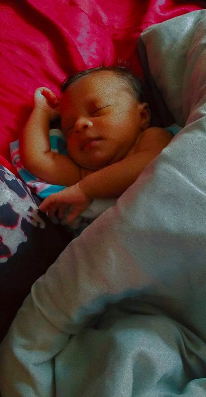 Danielle is registered to the contest to win money with this photo: baby, baby_products, baby_sleeping, baby_toddler_clothing, bedding, bedtime, carmine, cheek, child, childbirth, comfort, flesh, linens, mouth, nap, nose, person, room, skin, sleep