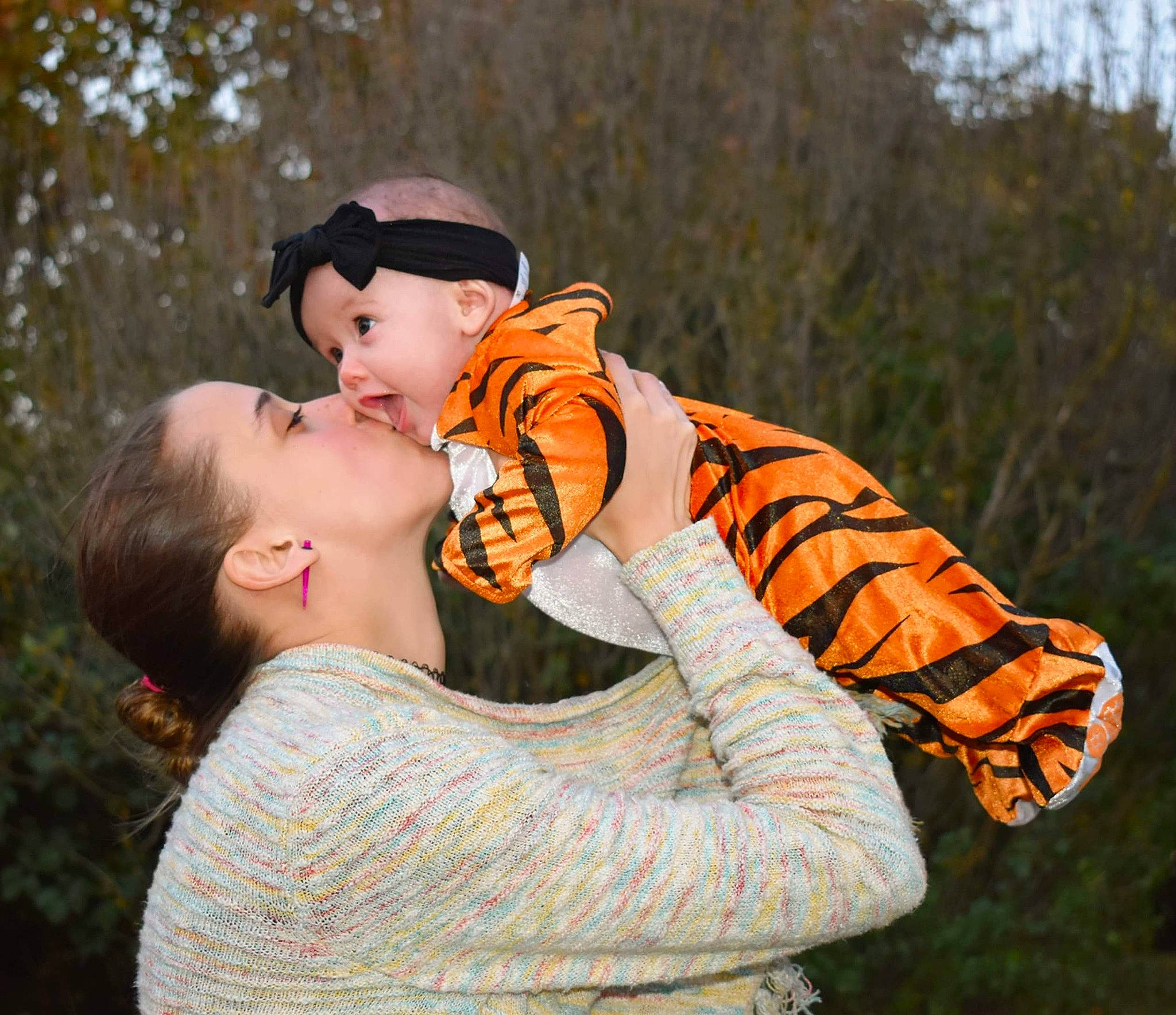 Lyriq joined the competition — help win amazing prizes! baby, baseball_cap, cap, child, flash_photography, fun, gesture, glove, grass, happy, headwear, hug, orange, outerwear, people_in_nature, person, personal_protective_equipment, player, portrait_photography, recreation