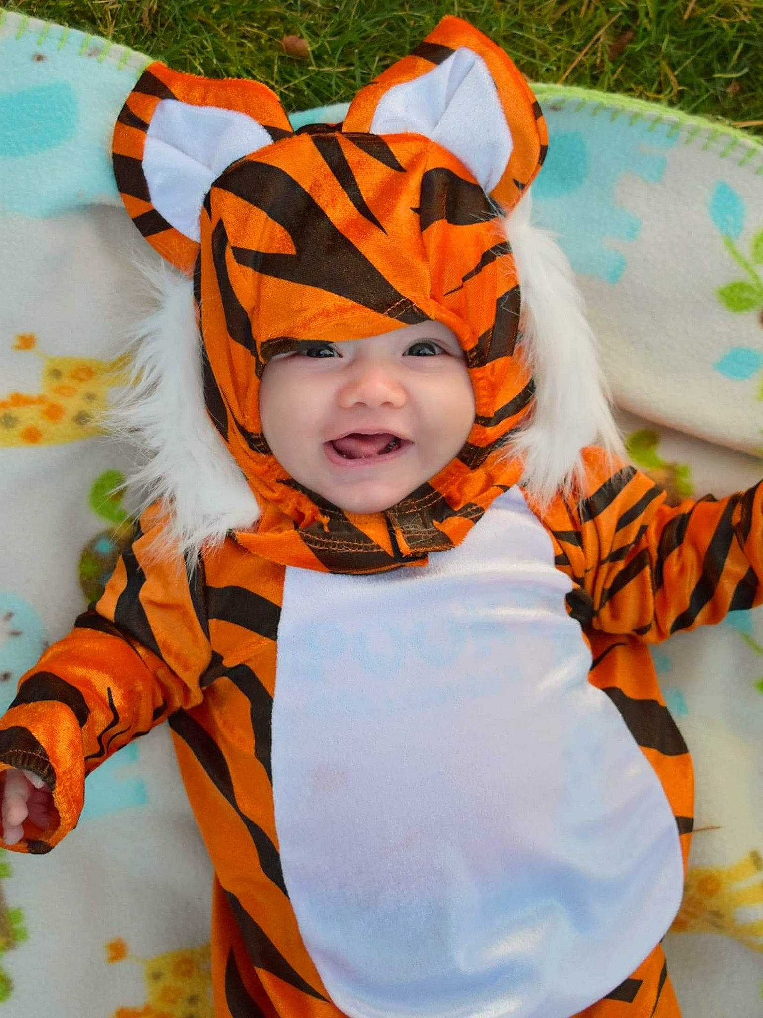 Lyriq joined the competition — help win amazing prizes! baby, baby_toddler_clothing, child, costume_accessory, costume_hat, eye, fashion_accessory, fun, happy, headwear, orange, pattern, peach, person, personal_protective_equipment, scarf, sleeve, smile, toddler, tree