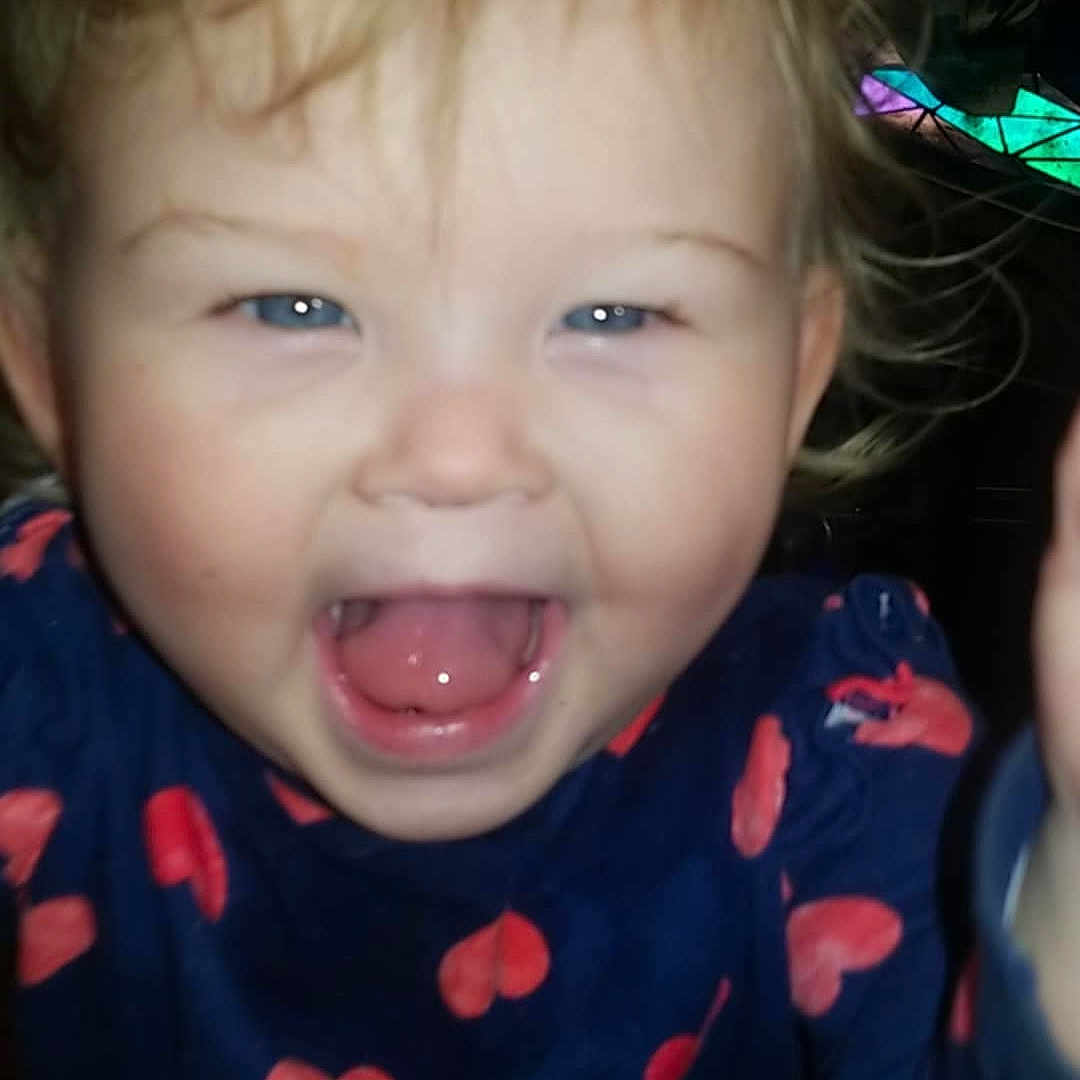 Emma joined the competition — help win amazing prizes! baby, babylaughing, bodypart, clothing, cosmetics, cutlery, face, happy, head, laughing, lipstick, mouth, pajamas, person, photography, portrait, smile, spoon, t_shirt, teeth