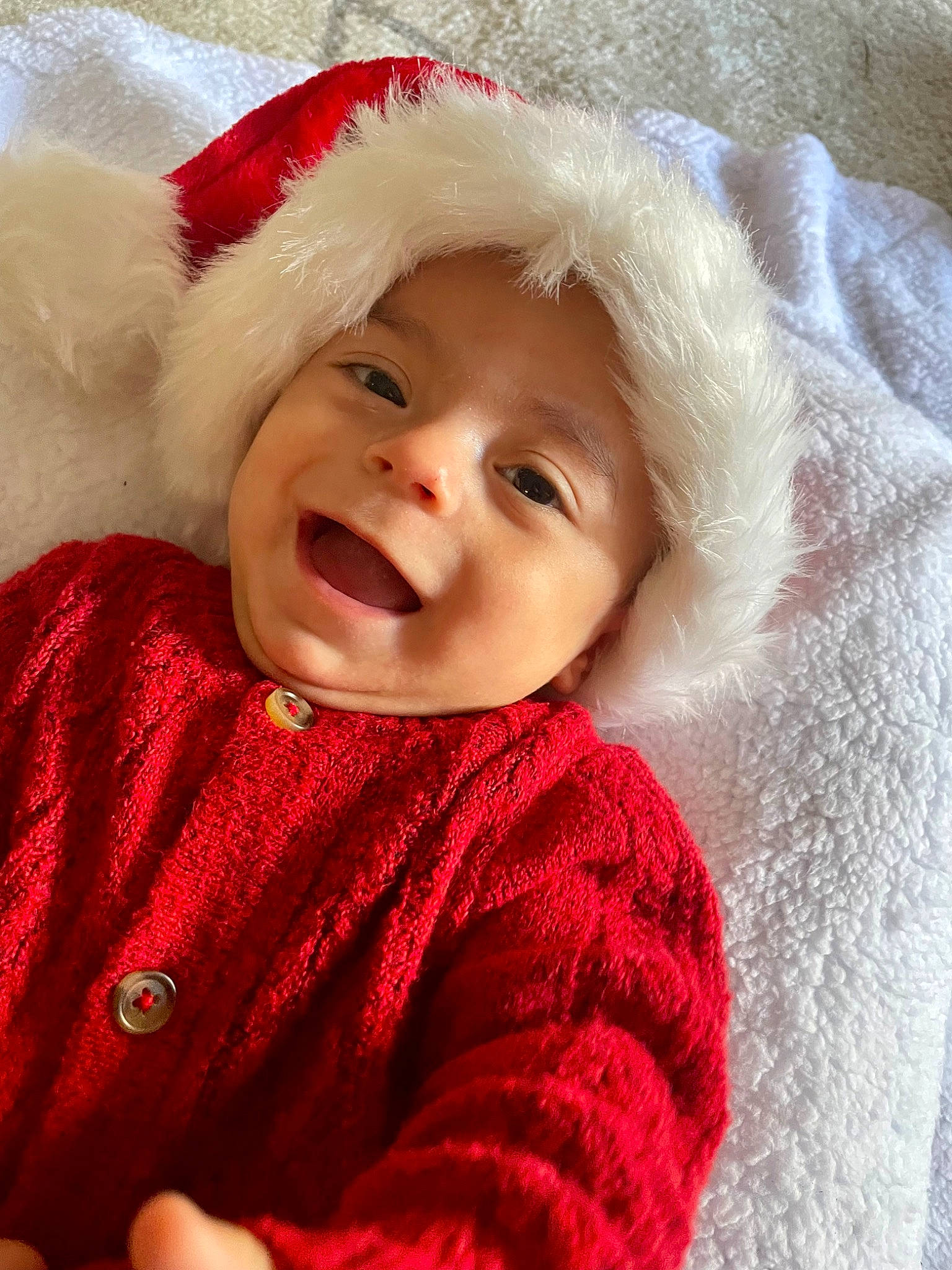 Gaige is registered to the contest to win money with this photo: baby, baby_toddler_clothing, cap, cheek, child, chin, clothing, costume_hat, eye, face, facial_expression, happy, headwear, human_body, lip, outerwear, person, santa_claus, skin, sleeve