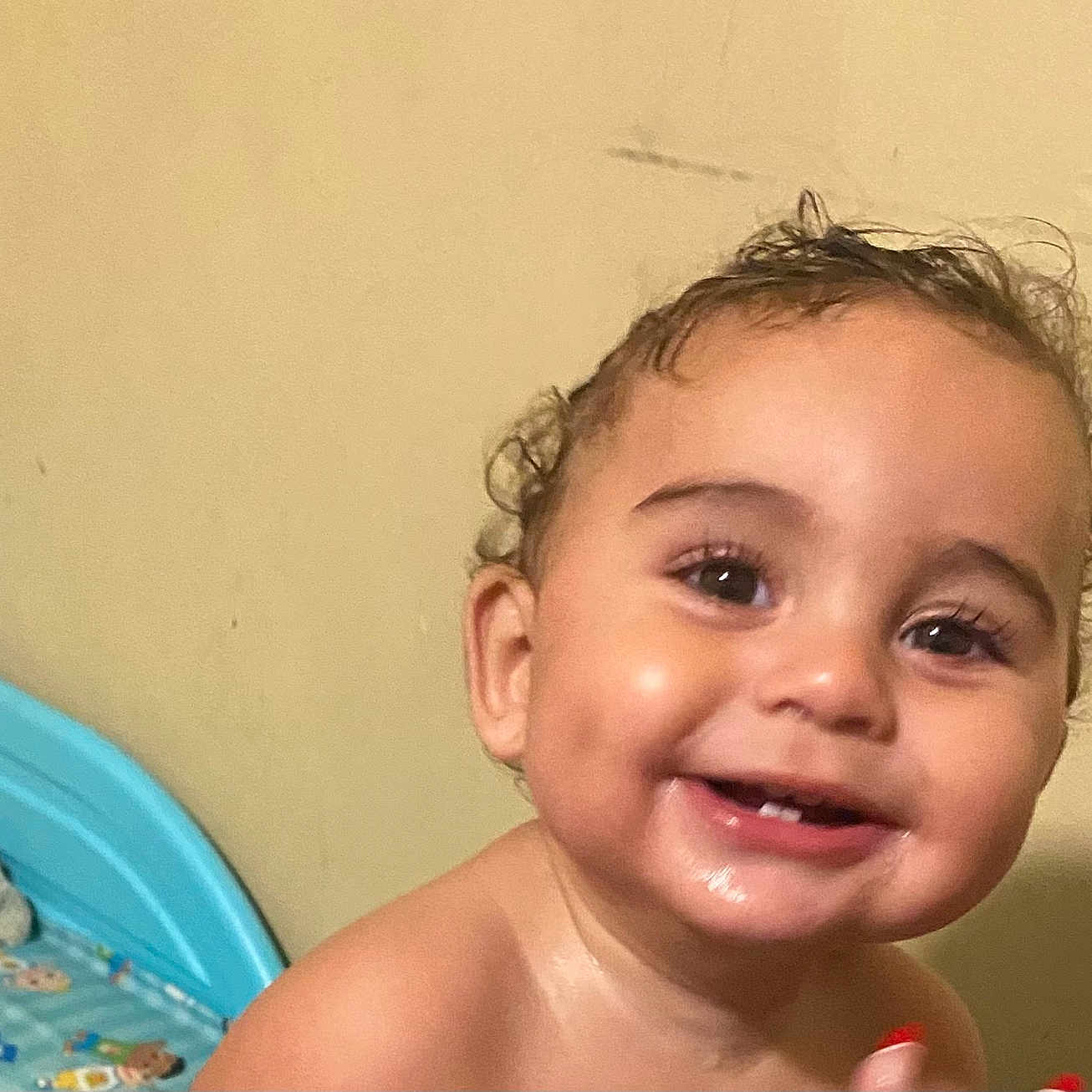 Elijah is registered to the contest to win money with this photo: baby, bed, bedframe, bedroom, blanket, child, closeup, curly_hair, eyes, face, happy, indoor, person, pillow, portrait, skin, smiling, teeth, toddler, young_child