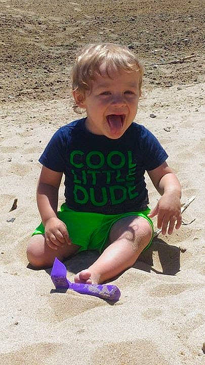 Brayden is registered to the contest to win money with this photo: beach, child, fun, leg, person, play, sand, sitting, smile, summer, toddler, vacation, water