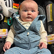 Berkley joined the competition — help win amazing prizes! baby, child, infant, car_seat, zebra_toy, plush_toy, portrait, sitting, indoors, vehicle, blue_clothing, polka_dots, wide_eyed, looking_at_camera, face, hands, socks, harness, stroller, cute