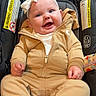 Berkley joined the competition — help win amazing prizes! baby, infant, child, smiling, happy, portrait, car_seat, safety_harness, bow, headband, tan_outfit, jumpsuit, socks, fluffy_socks, seated, indoor, close_up, vehicle, carriage, cute