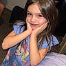 child, girl, smile, indoor, dress, cartoon, bed, blanket, long_hair, person, happy, cute, young, standing, room, carpet, wall, window, hand_on_face, playful