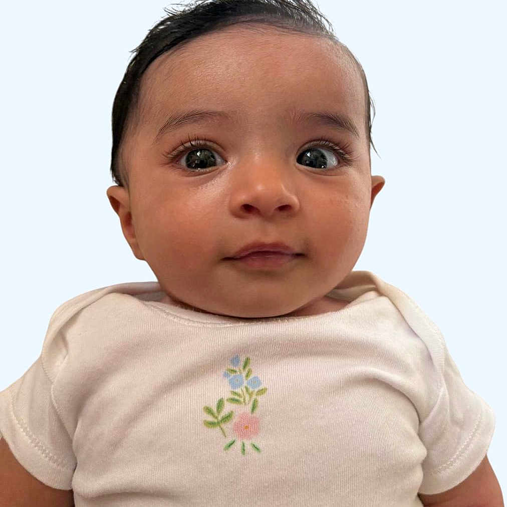 Isabel Sibin joined the competition — help win amazing prizes! baby, child, chubby, close_up, curious_eyes, cute, expression, face, floral_embroidery, hair, infant, innocence, onesie, portrait, skin, smile, soft_background, toddler, white_clothing, young