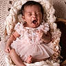 baby, infant, yawning, pink_dress, frills, knit_blanket, wooden_bowl, sleepy, cute, newborn, soft_texture, portrait, indoor, cozy, toddler, child, person, skin, hands, feet