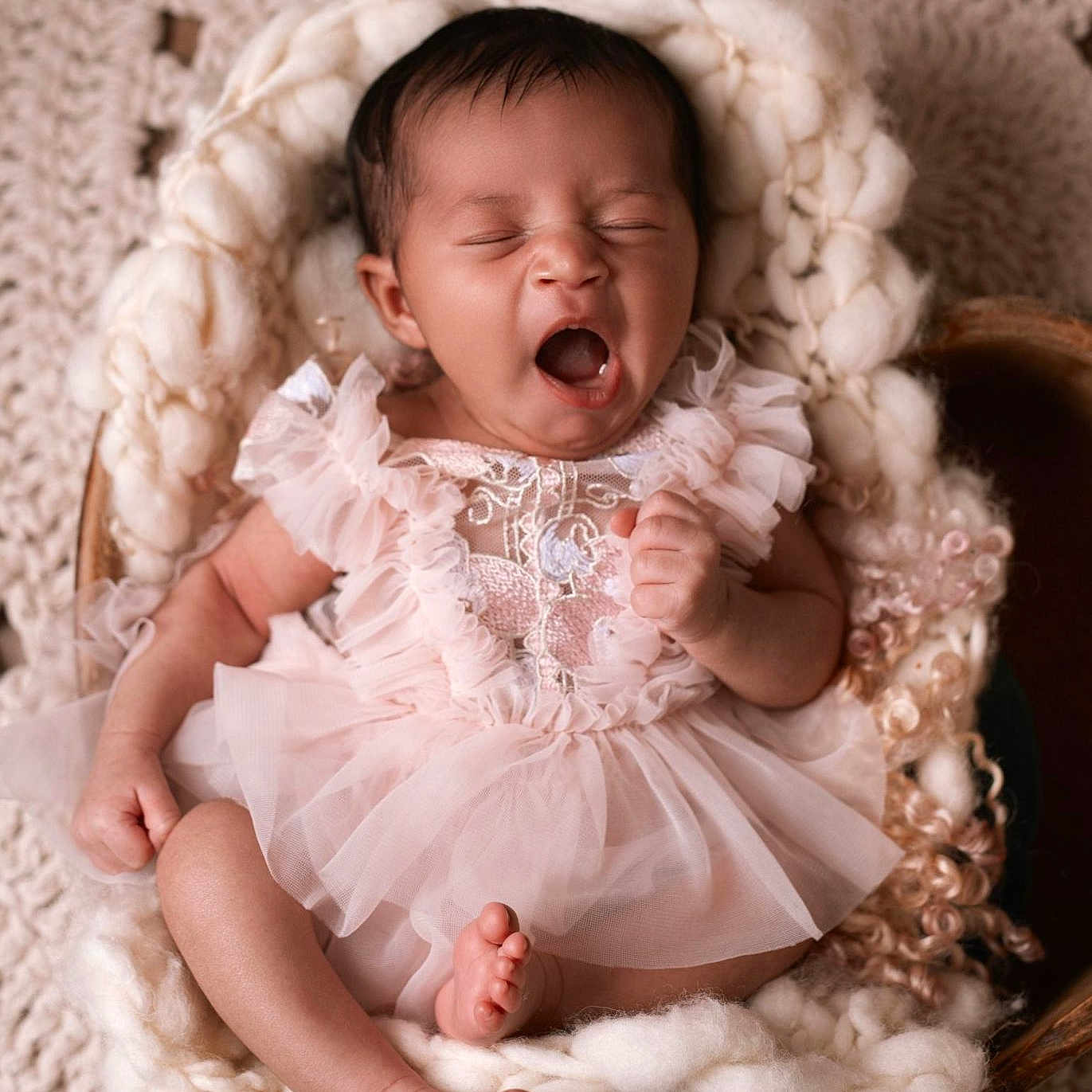 Zeynah participe au concours pour gagner de l'argent avec cette photo : baby, infant, yawning, pink_dress, frills, knit_blanket, wooden_bowl, sleepy, cute, newborn, soft_texture, portrait, indoor, cozy, toddler, child, person, skin, hands, feet
