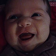 Alazea joined the competition — help win amazing prizes! baby, close_up, face, smile, tongue_out, infant, clothing, polka_dot, happy, cute, child, portrait, indoors, dark, cozy, warm, expression, head, person, newborn