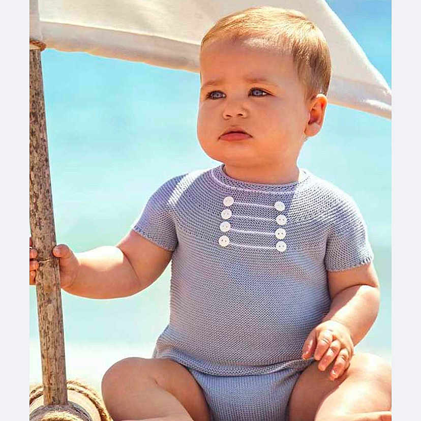 Liam is registered to the contest to win money with this photo: accessories, baby, beachwear, blonde, bodypart, clothing, dress, face, finger, frown, furniture, hair, hand, happy, head, jewelry, knitwear, longsleeve, neck, necklace